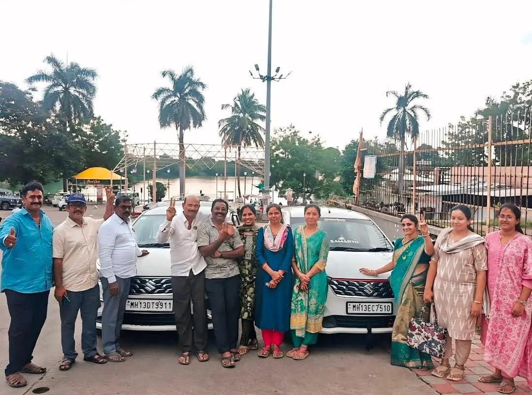 Family tour group with Shourya Tours & Travels cab
